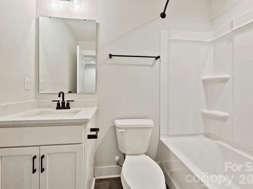 1227 34th Street, Charlotte, NC 28205.  MLS# CAR4211267, YatesRealty ID 3426. Rec Room with Powder Room & Rooftop Terrace *Virtually Staged*