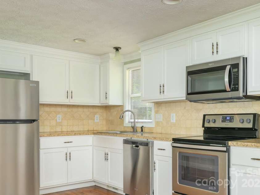 9012 McMillian Drive, Harrisburg, NC 28075.  MLS# CAR4295135, YatesRealty ID 34264. Kitchen