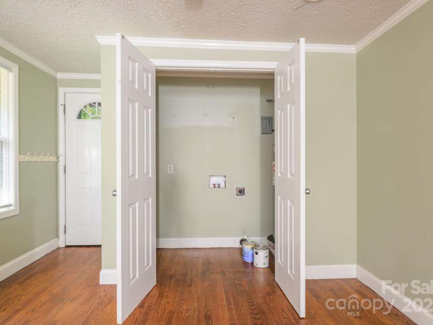 9012 McMillian Drive, Harrisburg, NC 28075.  MLS# CAR4295135, YatesRealty ID 34264. Laundry in kitchen