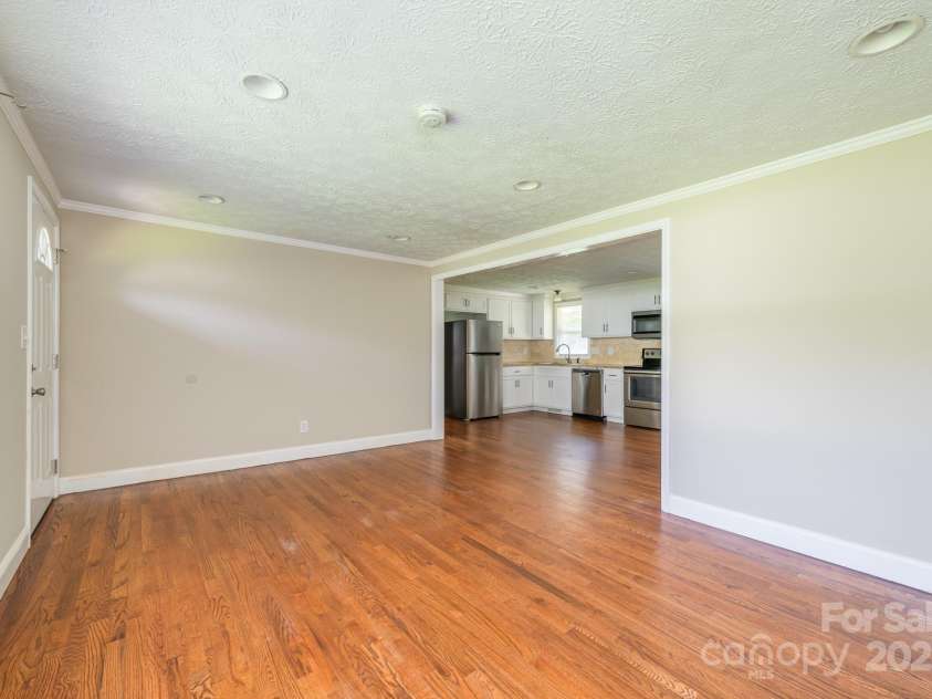 9012 McMillian Drive, Harrisburg, NC 28075.  MLS# CAR4295135, YatesRealty ID 34264. Living room