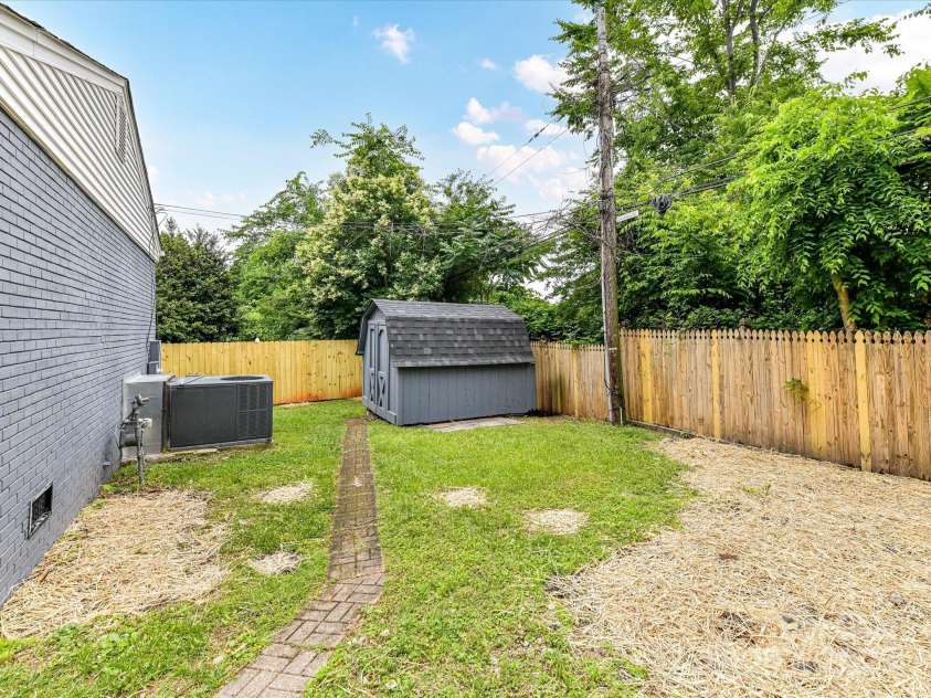 2017 Brewton Drive, Charlotte, NC 28206.  MLS# CAR4265702, YatesRealty ID 34269. The backyard is nice and flat and has a new wooden privacy fence!