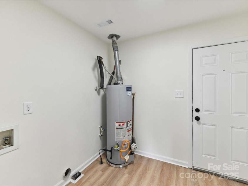 2017 Brewton Drive, Charlotte, NC 28206.  MLS# CAR4265702, YatesRealty ID 34269. The home has good sized laundry room with exterior access.