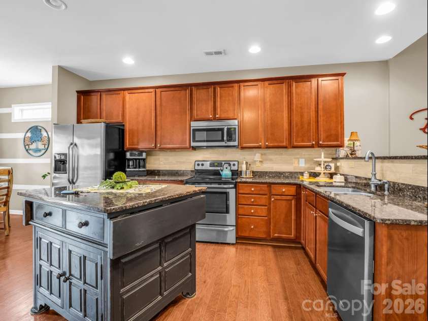 8 Mallard Run Drive, Arden, NC 28704.  MLS# CAR4395939, YatesRealty ID 34277. Custom kitchen island provides additional work area and storage.