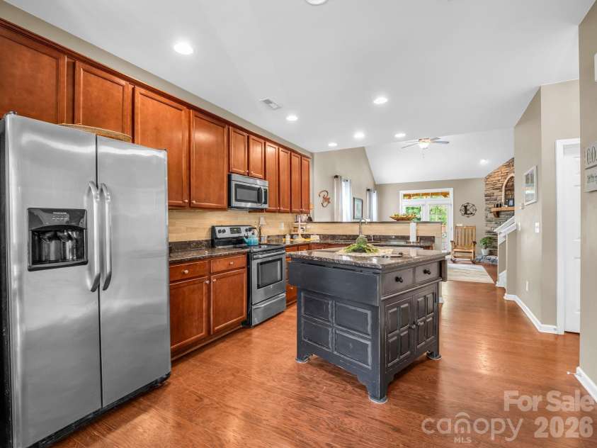 8 Mallard Run Drive, Arden, NC 28704.  MLS# CAR4395939, YatesRealty ID 34277. Open floorplan dining area, kitchen and living room.