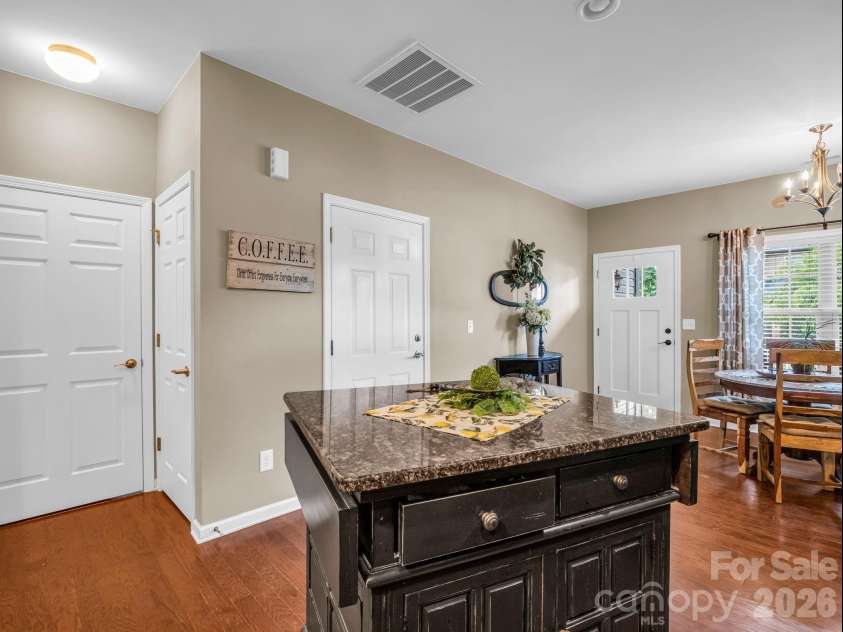 8 Mallard Run Drive, Arden, NC 28704.  MLS# CAR4395939, YatesRealty ID 34277. View from kitchen showing entry, pantry and laundry room.