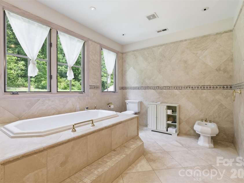 811 Butter Street, Landrum, SC 29356.  MLS# CAR4394031, YatesRealty ID 34280. En Suite Custom Tiled Bath