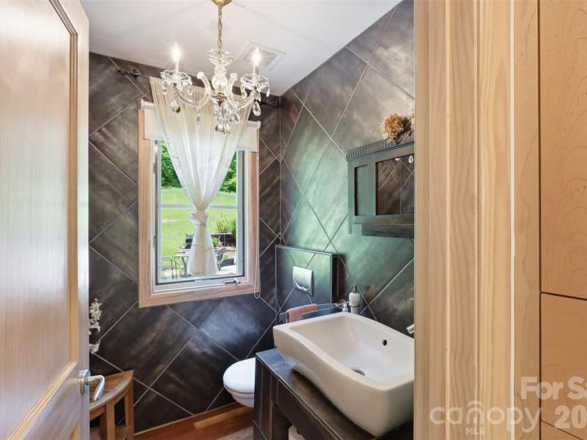 811 Butter Street, Landrum, SC 29356.  MLS# CAR4394031, YatesRealty ID 34280. Main Level Custom Tiled Bath Heated Floors