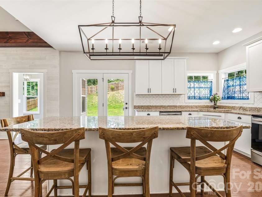 16 Henbit Way, Arden, NC 28704.  MLS# CAR4394506, YatesRealty ID 34286. Lovely Kitchen - Oversized Center Island - Designer Light Fixtures.