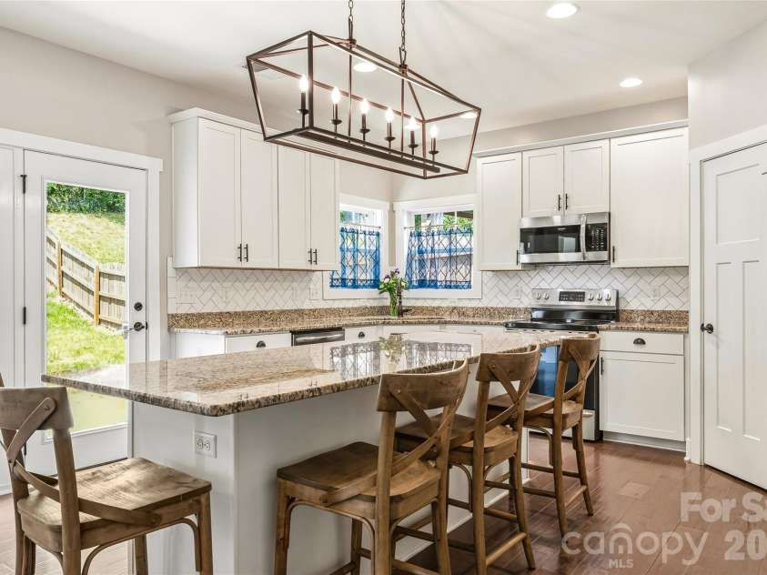 16 Henbit Way, Arden, NC 28704.  MLS# CAR4394506, YatesRealty ID 34286. Open Kitchen and oversized center Island 