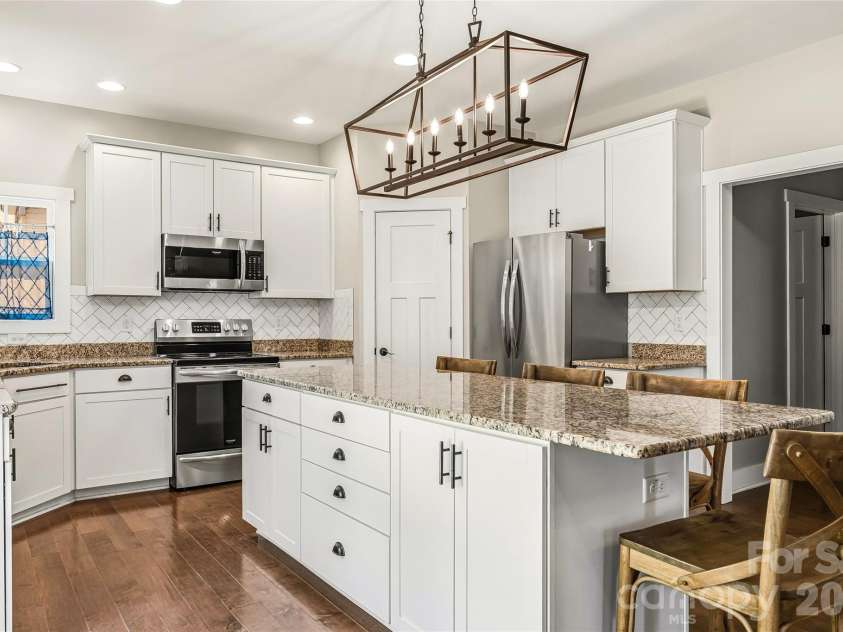 16 Henbit Way, Arden, NC 28704.  MLS# CAR4394506, YatesRealty ID 34286. Oversized center Island - walk in Pantry