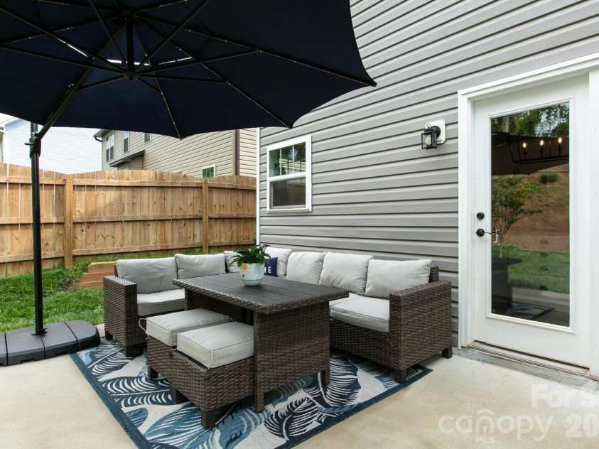 16 Henbit Way, Arden, NC 28704.  MLS# CAR4394506, YatesRealty ID 34286. Patio off Kitchen and Sun Room 