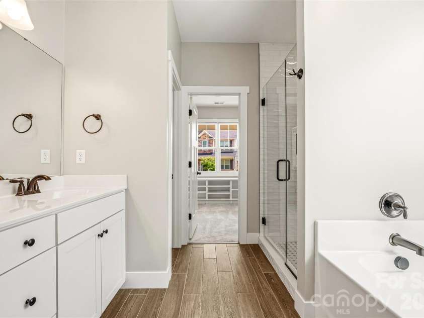 16 Henbit Way, Arden, NC 28704.  MLS# CAR4394506, YatesRealty ID 34286. Primary Bath suite and a large walk-in closet. 