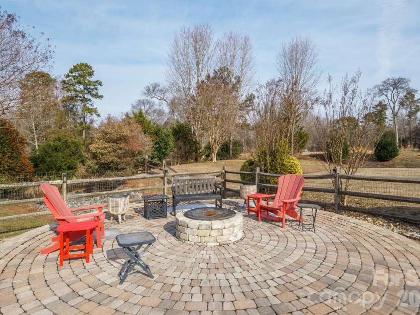 9776 Ravenscroft Lane, Concord, NC 28027.  MLS# CAR4335767, YatesRealty ID 3430. Fabulous outdoor living with fire pit