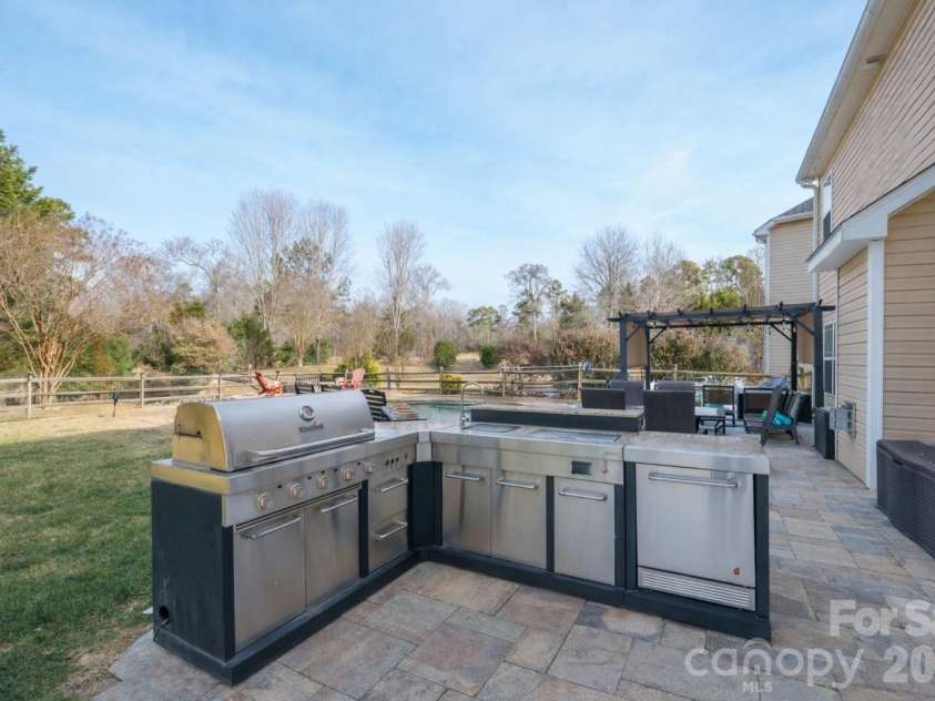 9776 Ravenscroft Lane, Concord, NC 28027.  MLS# CAR4335767, YatesRealty ID 3430. Outdoor kitchen 