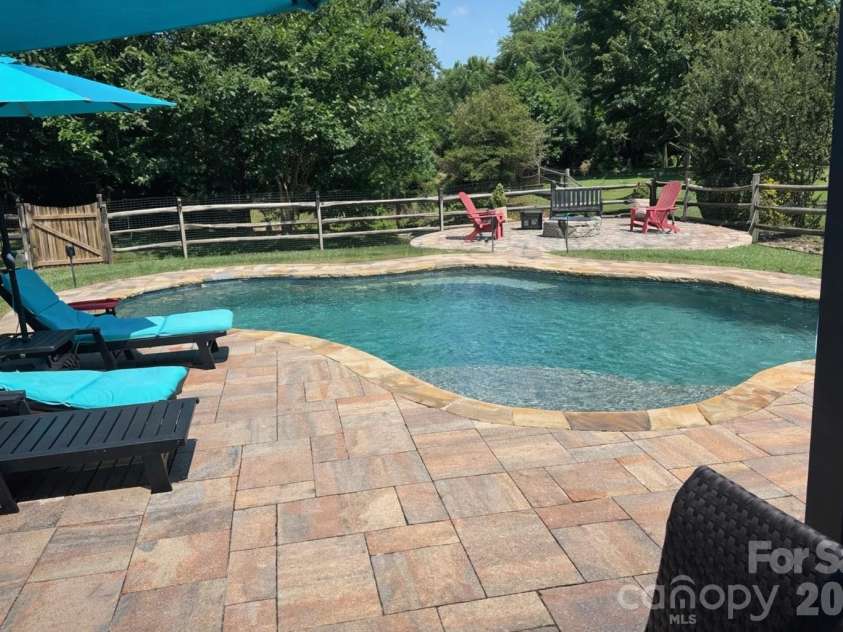 9776 Ravenscroft Lane, Concord, NC 28027.  MLS# CAR4335767, YatesRealty ID 3430. Pool in your yard allows for perfect night swims!