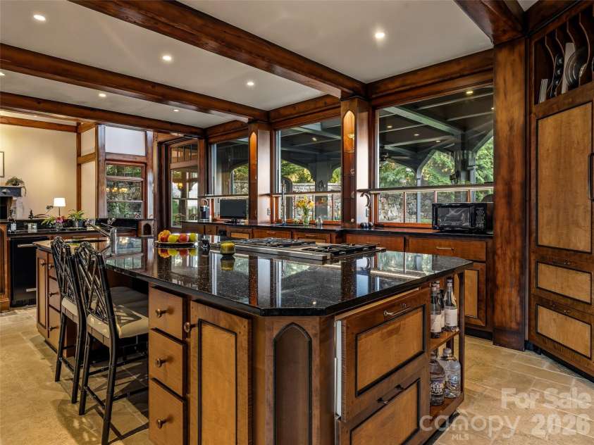 7 Stuyvesant Road, Biltmore Forest, NC 28803.  MLS# CAR4399197, YatesRealty ID 34302. Copious windows bring  the views into the kitchen/ great room.
