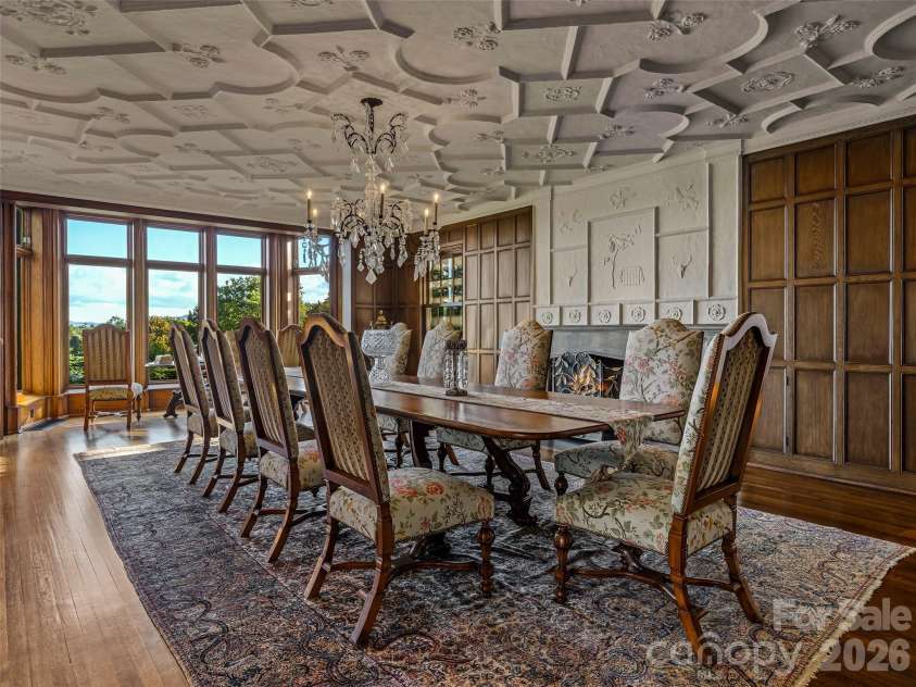 7 Stuyvesant Road, Biltmore Forest, NC 28803.  MLS# CAR4399197, YatesRealty ID 34302. Formal dining room with fireplace and plaster tracery ceiling