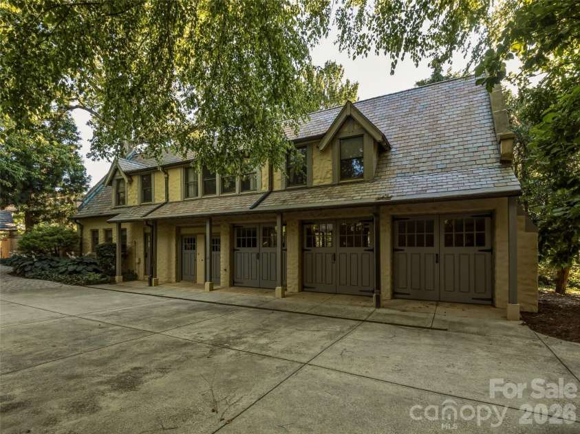 7 Stuyvesant Road, Biltmore Forest, NC 28803.  MLS# CAR4399197, YatesRealty ID 34302. Guest house with extra garages