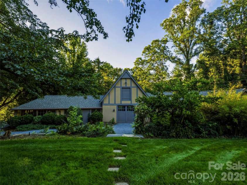 7 Stuyvesant Road, Biltmore Forest, NC 28803.  MLS# CAR4399197, YatesRealty ID 34302. Historic stable with garage space and storage rooms plus one roomw ith HVAc and a basic bath.
