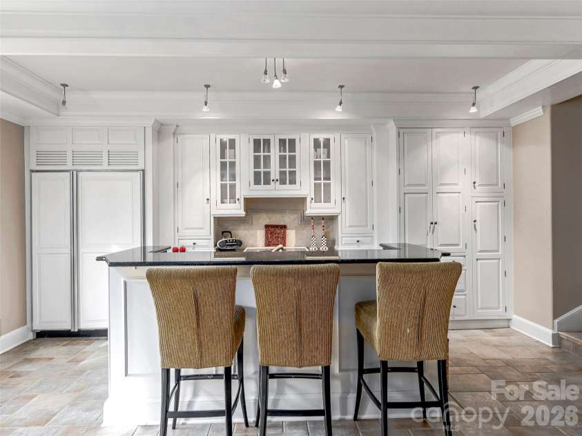 7 Stuyvesant Road, Biltmore Forest, NC 28803.  MLS# CAR4399197, YatesRealty ID 34302. Pool kitchen adjoining pool great room/exercise