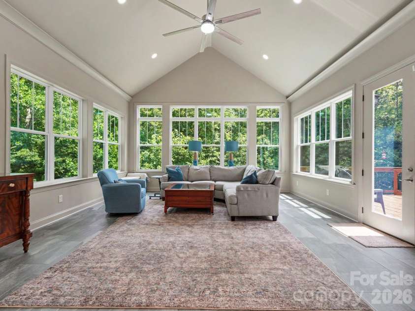 9560 Regent Drive, Davidson, NC 28036.  MLS# CAR4397866, YatesRealty ID 34310. Amazing sunroom vaulted ceiling and leads to private deck