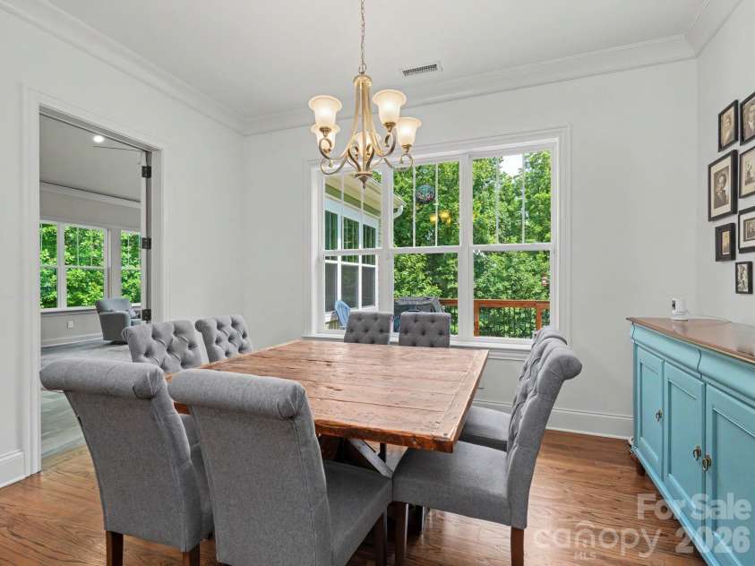 9560 Regent Drive, Davidson, NC 28036.  MLS# CAR4397866, YatesRealty ID 34310. Breakfast area leads to deck and overlooks  huge fenced backyard