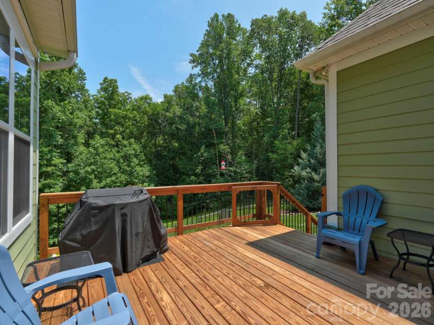 9560 Regent Drive, Davidson, NC 28036.  MLS# CAR4397866, YatesRealty ID 34310. Private deck overlooking huge fenced backyard and woods