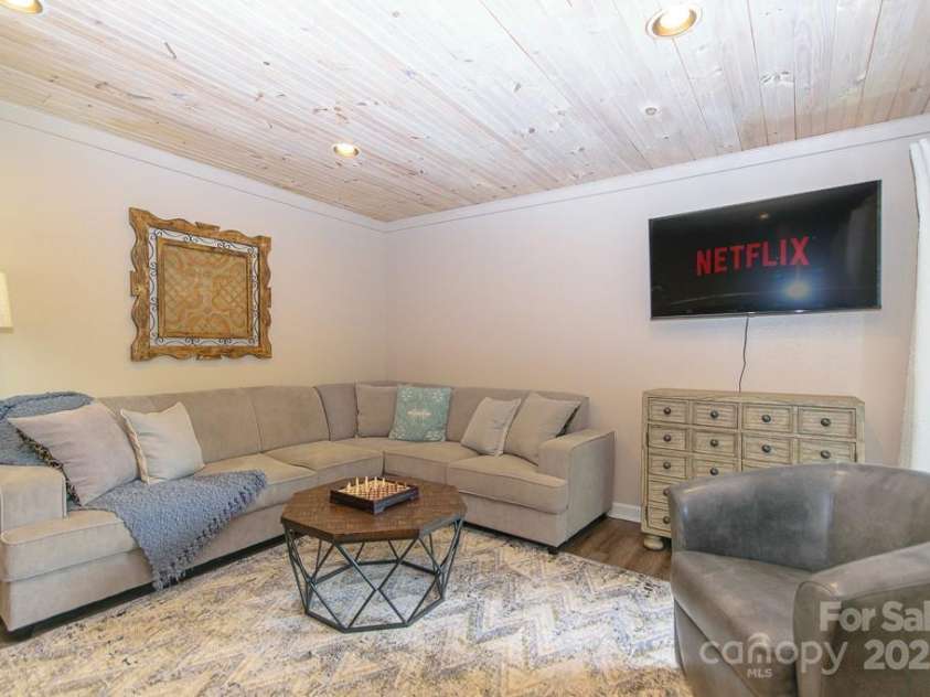 114 Locust Ridge Road, Beech Mountain, NC 28604.  MLS# CAR4295820, YatesRealty ID 34315. Lower level den/ game room