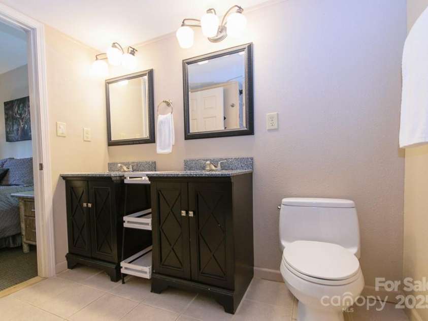 114 Locust Ridge Road, Beech Mountain, NC 28604.  MLS# CAR4295820, YatesRealty ID 34315. Primary ensuite bathroom