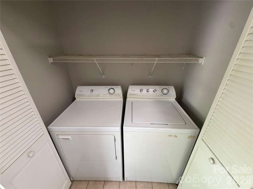 21230 Hickory Street, Cornelius, NC 28031.  MLS# CAR4374106, YatesRealty ID 34318. Laundry Closet at rear entry