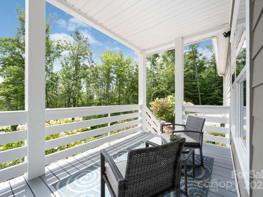 209 Patriots Drive, Asheville, NC 28805.  MLS# CAR4291919, YatesRealty ID 34321. Covered front row seats to the changing seasons.