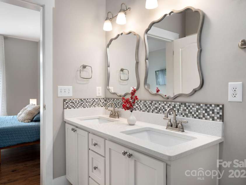 209 Patriots Drive, Asheville, NC 28805.  MLS# CAR4291919, YatesRealty ID 34321. Double sink vanity en suite.