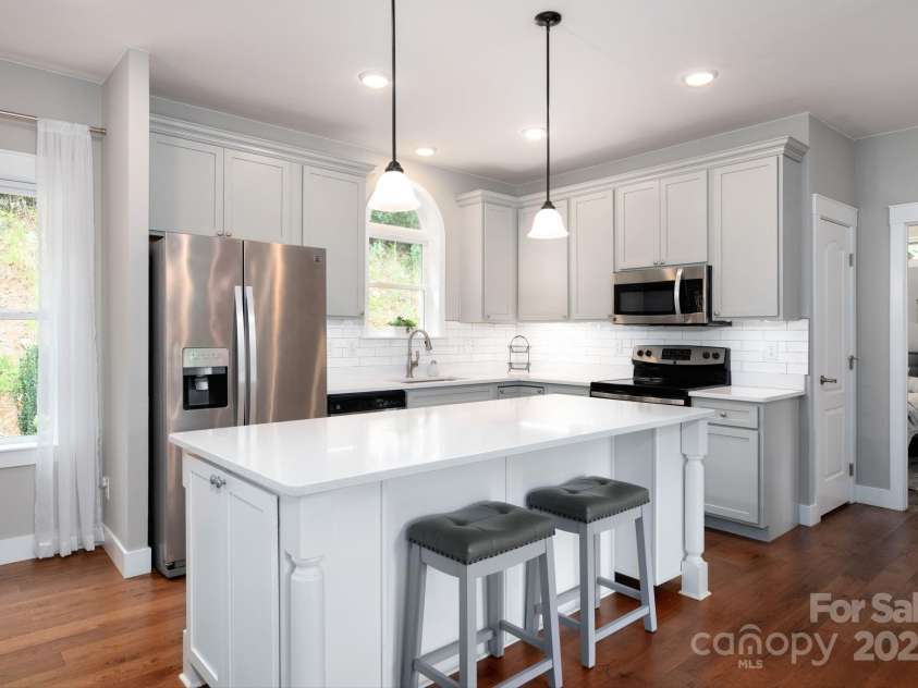 209 Patriots Drive, Asheville, NC 28805.  MLS# CAR4291919, YatesRealty ID 34321. Gather 'round the large island.