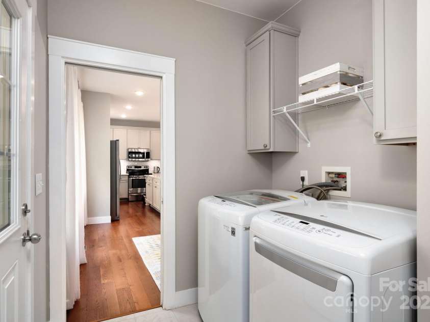 209 Patriots Drive, Asheville, NC 28805.  MLS# CAR4291919, YatesRealty ID 34321. Laundry utility space connects kitchen and garage.