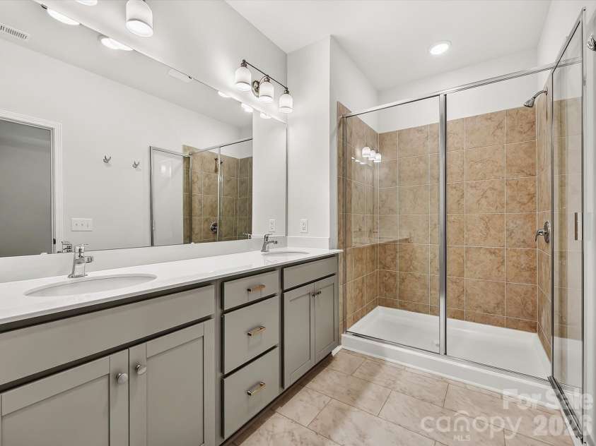 6557 Fire Lily Lane, Charlotte, NC 28216.  MLS# CAR4383907, YatesRealty ID 34325. Owner's Bathroom