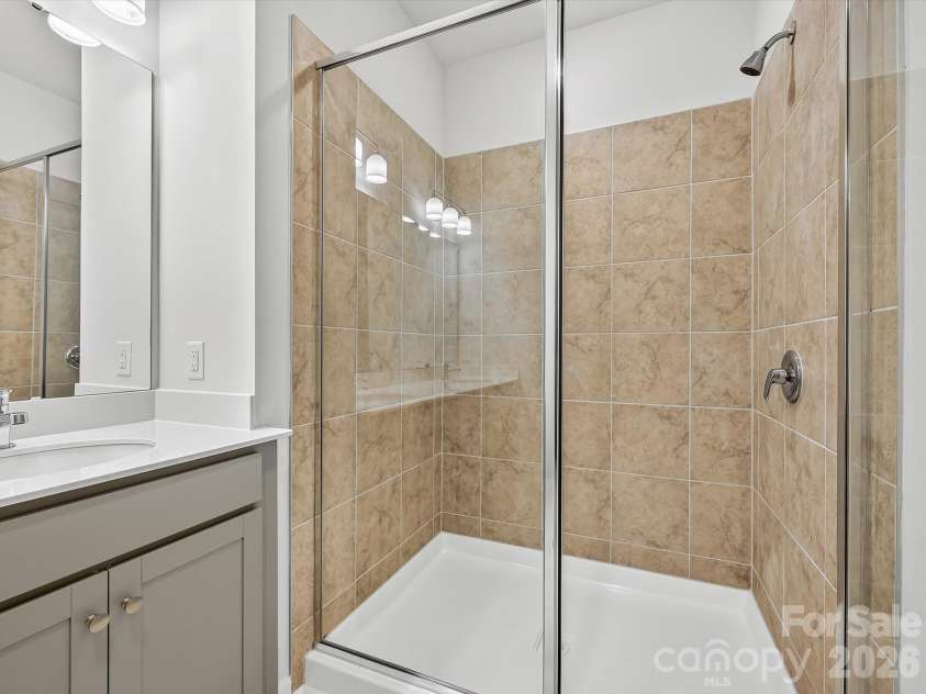 6557 Fire Lily Lane, Charlotte, NC 28216.  MLS# CAR4383907, YatesRealty ID 34325. Owner's Shower