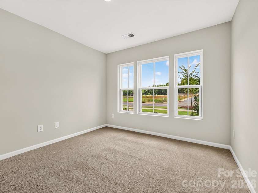 6557 Fire Lily Lane, Charlotte, NC 28216.  MLS# CAR4383907, YatesRealty ID 34325. Secondary Bedroom on 1st Floor