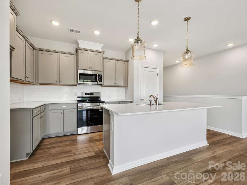 6557 Fire Lily Lane, Charlotte, NC 28216.  MLS# CAR4383907, YatesRealty ID 34325. Upgraded cabinets with Crown Molding and Soft Close Doors