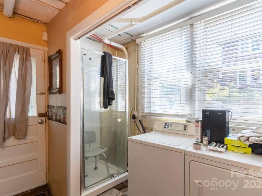 56 Brevard Road, Asheville, NC 28806.  MLS# CAR4293196, YatesRealty ID 34333. Basement shower