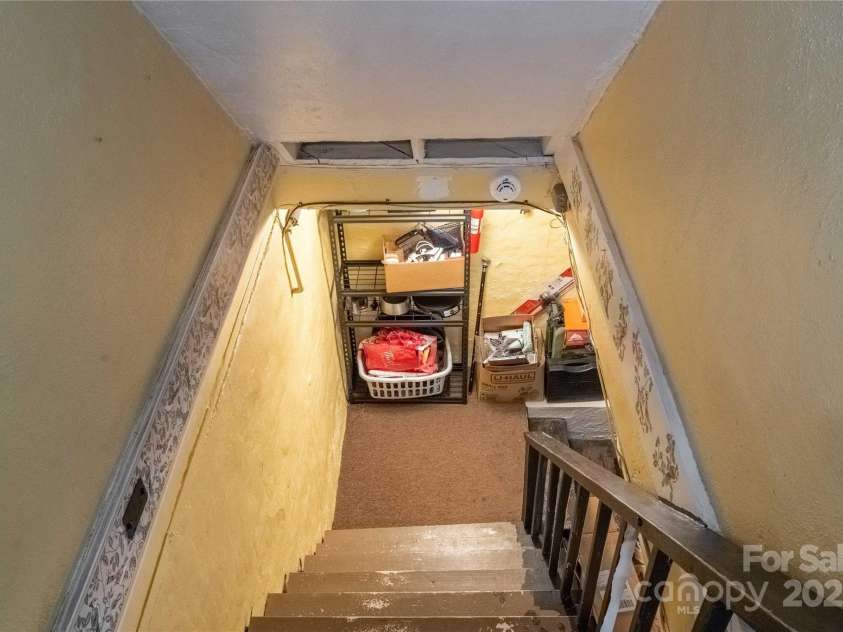 56 Brevard Road, Asheville, NC 28806.  MLS# CAR4293196, YatesRealty ID 34333. Basement Stairs