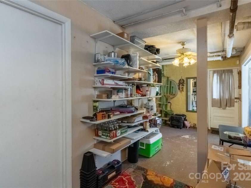 56 Brevard Road, Asheville, NC 28806.  MLS# CAR4293196, YatesRealty ID 34333. View from bottom of basement stairs