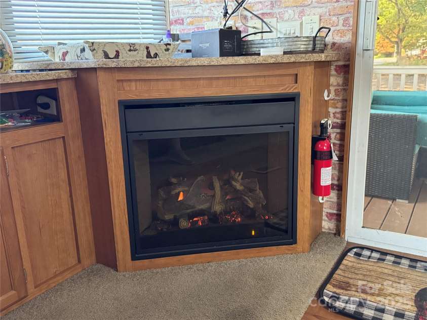 111 Club House Extension, New London, NC 28127.  MLS# CAR4295285, YatesRealty ID 34337. Electric heater fireplace