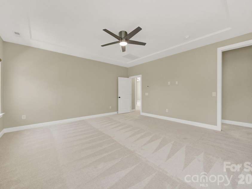 989 Emory Lane, Fort Mill, SC 29708.  MLS# CAR4356402, YatesRealty ID 34337. Primary bedroom w custom shades on REMOTE