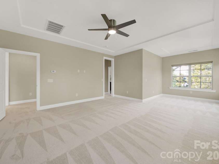 989 Emory Lane, Fort Mill, SC 29708.  MLS# CAR4356402, YatesRealty ID 34337. Primary bedroom w custom shades on REMOTE