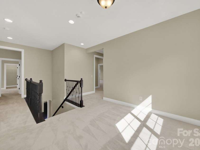 989 Emory Lane, Fort Mill, SC 29708.  MLS# CAR4356402, YatesRealty ID 34337. Sitting area upstairs has been painted blue