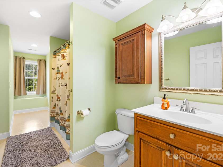 112 Berea Baptist Church Road, Stanfield, NC 28163.  MLS# CAR4173503, YatesRealty ID 3434. Bathroom on the upper level with tub shower combo