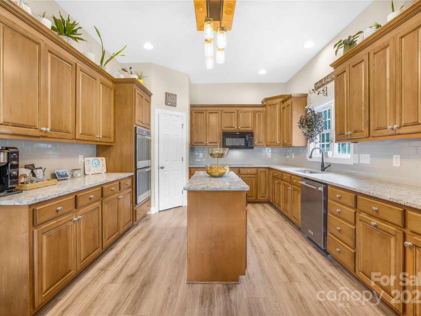 112 Berea Baptist Church Road, Stanfield, NC 28163.  MLS# CAR4173503, YatesRealty ID 3434. Kitchen features an Island, plenty of cabinet space, double wall over, cooktop and pantry!