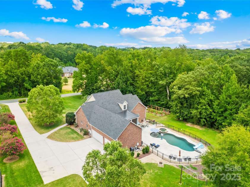 112 Berea Baptist Church Road, Stanfield, NC 28163.  MLS# CAR4173503, YatesRealty ID 3434. The home features over 4100 sq ft of living space, not including the walkout basement! Do you love entertaining and being outside? This is the home for you! In in-ground pool, hot tub, plenty of driveway space