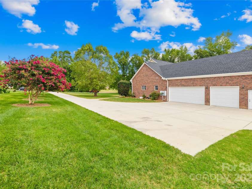 112 Berea Baptist Church Road, Stanfield, NC 28163.  MLS# CAR4173503, YatesRealty ID 3434. Three car garage is perfect for a car enthusiast!