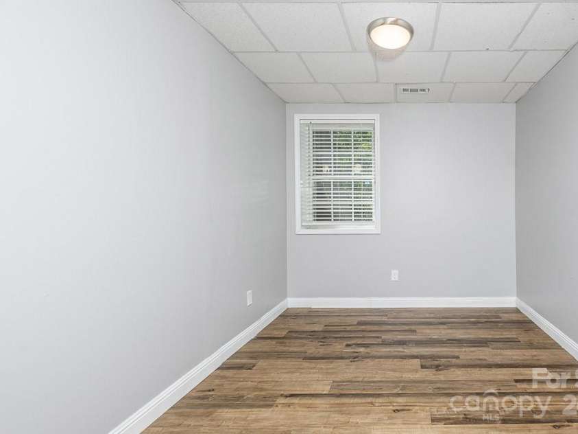 46 Badger Run, Hendersonville, NC 28739.  MLS# CAR4281037, YatesRealty ID 34340. Bright downstairs bonus room/bedroom.